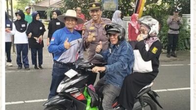 Semarak HUT RI ke-81, Polsek Lima Kaum Bersama Forkopimca Bagikan Bendera Merah Putih kepada Masyarakat